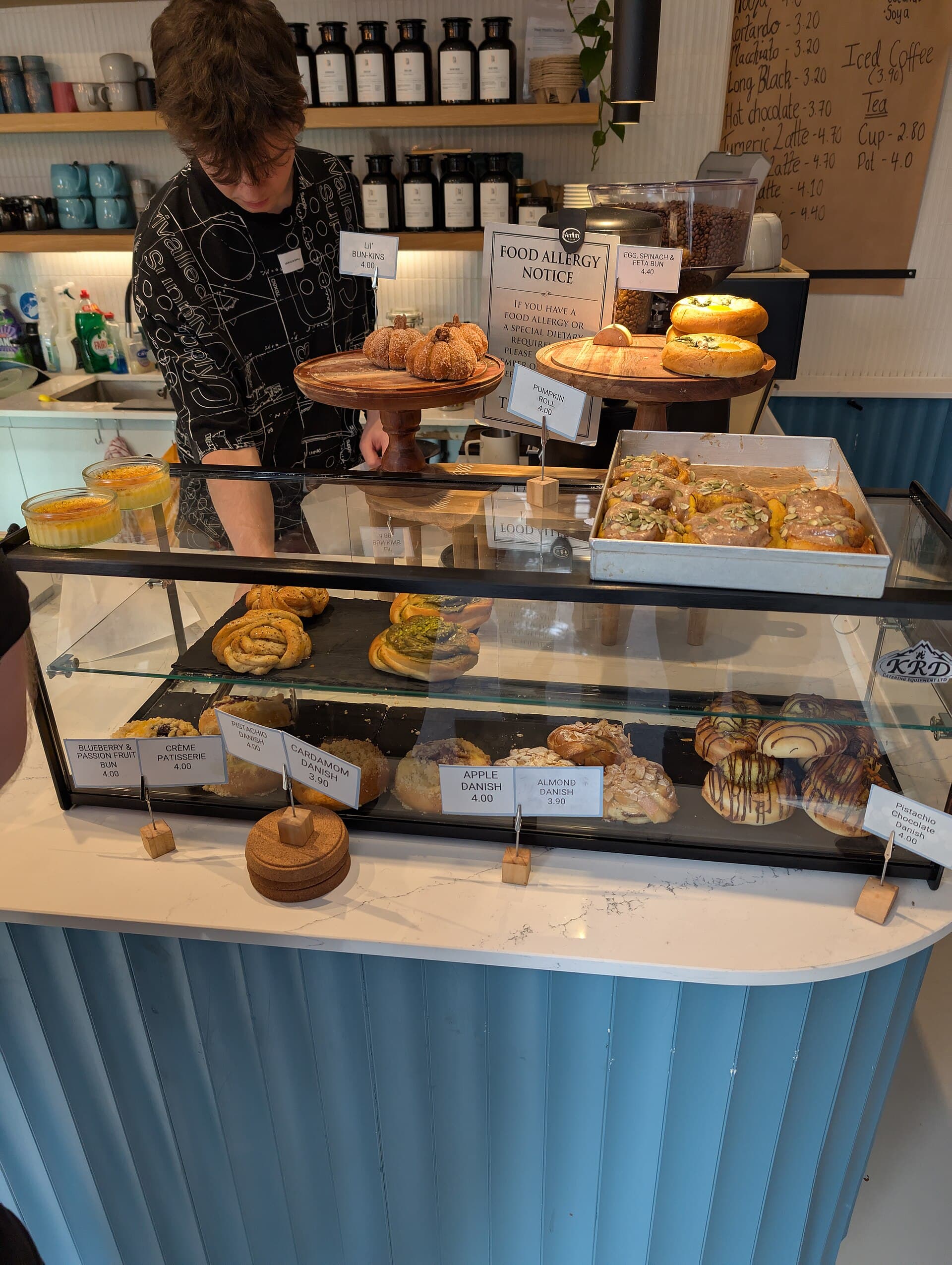 Baked goods for sale on a cafe counter.